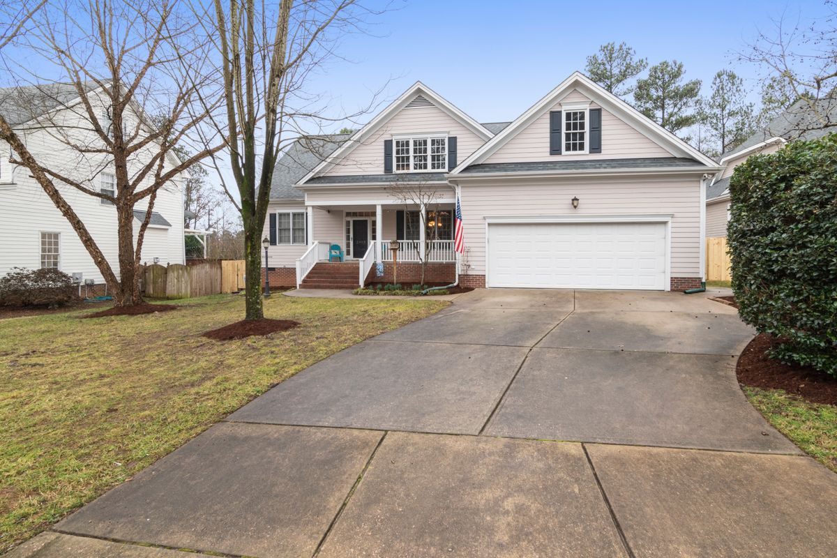 White family home with a long driveway